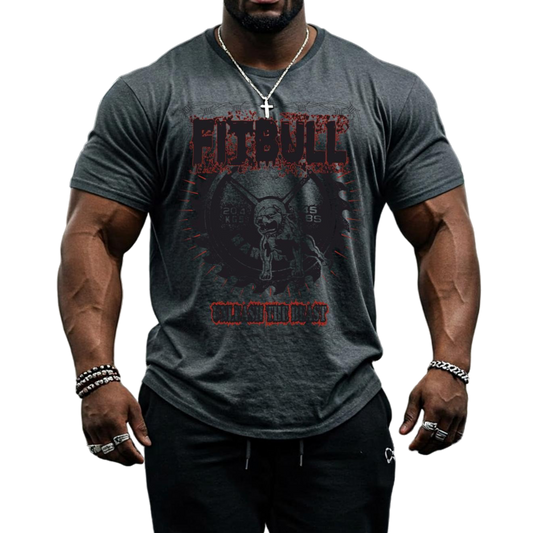 A male bodybuilder wears a chrcoal Fitbull Fit Wear T-shirt with a motivational Unleash The Beast print