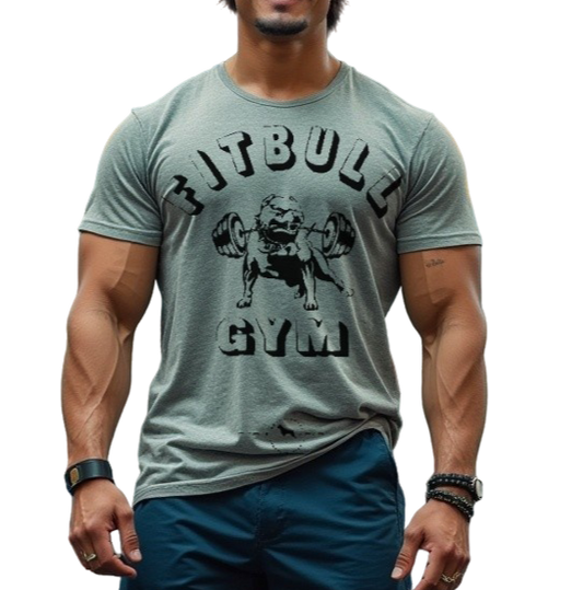 A man with a fitness body is wearing sporty joggers and a sporty light grey Fitbull T-shirt with a motivating Fitbull Gym print.