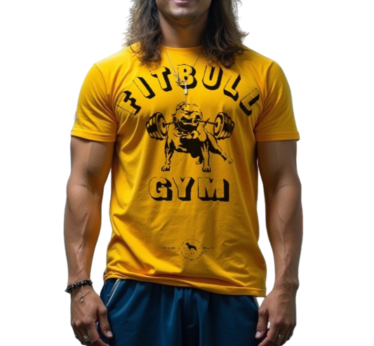 A man with a fitness body is wearing sporty joggers and a sporty yelow Fitbull T-shirt with a motivating Fitbull Gym print.