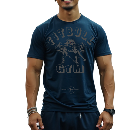 A man with a fitness body is wearing sporty joggers and a sporty navy blue Fitbull T-shirt with a motivating Fitbull Gym print. 