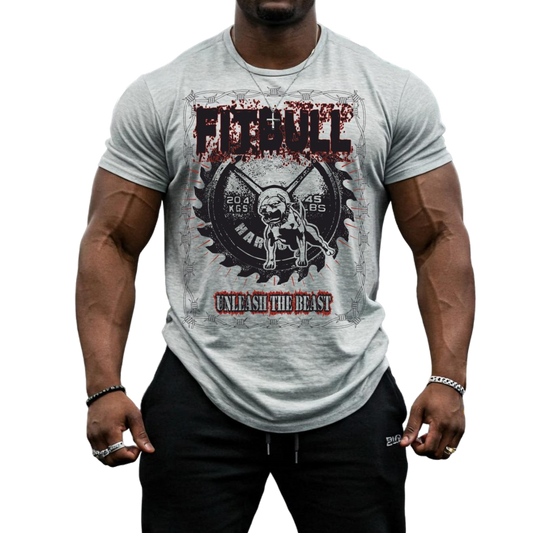 A male bodybuilder wears a silver Fitbull Fit Wear T-shirt with a motivational Unleash The Beast print