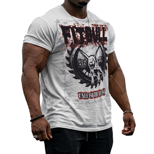 A male bodybuilder wears a white Fitbull Fit Wear T-shirt with a motivational Unleash The Beast print